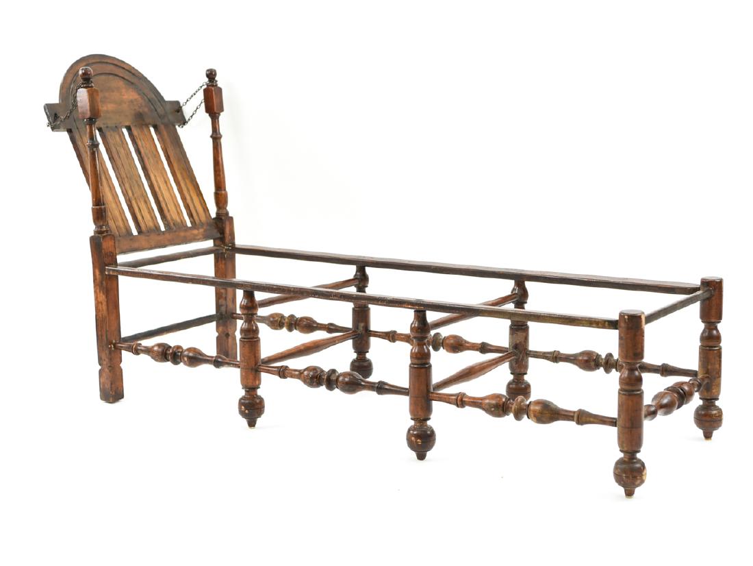 WALLACE NUTTING RECLINING CHAISE LOUNGE: Signed under headrest. Dimensions: H 40" x W 67" x D 24" Condition: Frame only, as shown. Slightly wobbly. Visible glue at some joints.