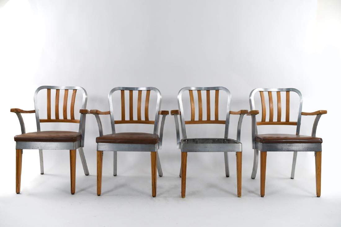 (4) SHAW WALKER ALUMINUM & WOOD ARMCHAIRS: Dimensions: H 32" x W 24.75" x D 22.5" x SH 18" Condition: As is. One missing seat. Some deterioration to seat cushions. Marks and wear throughout.