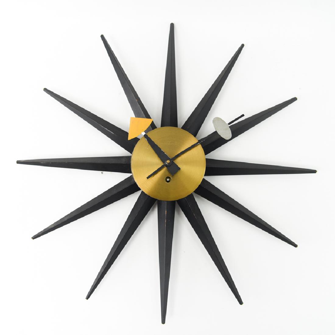 GEORGE NELSON FOR HOWARD MILLER SUNBURST CLOCK: Marked Howard Miller Clock Co. Dimensions: Dia. 18.5" Condition: Not tested. Wear to edges of spikes. One spike loose.