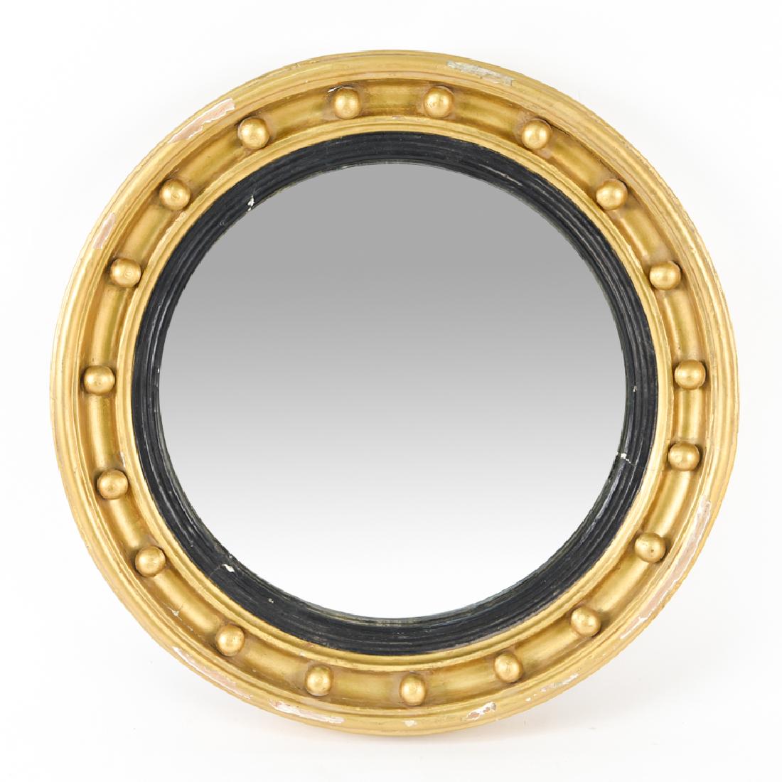 GILT ROUND CONVEX MIRROR: Gilt wood. Dimensions: Dia. 22" Condition: Losses to gilding, heavy wear to frame.