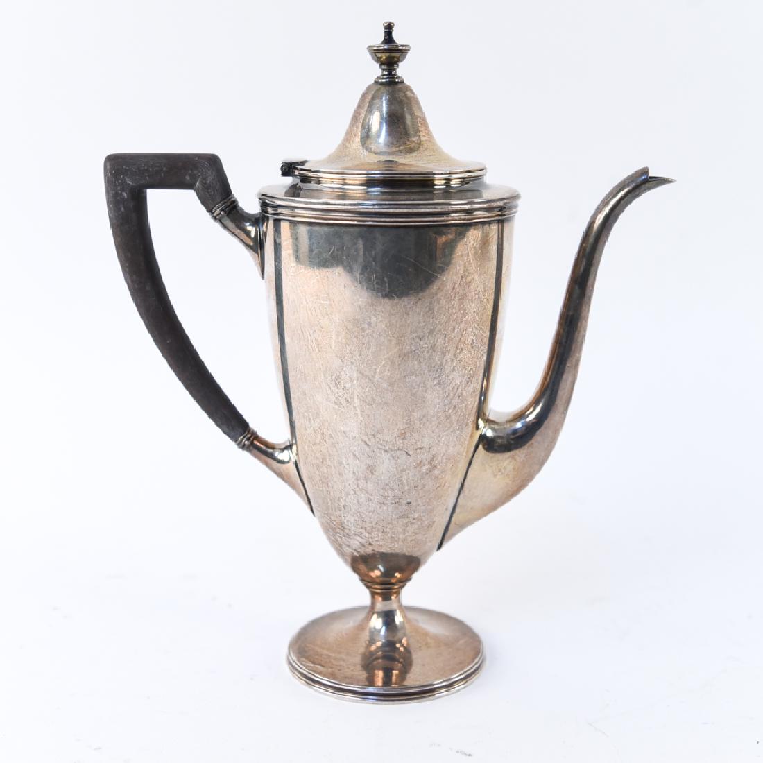 TIFFANY & CO. MAKERS STERLING SILVER TEAPOT: Marked underneath. Dimensions: H 9.5" x W 7.75" x D 3.5" Weight: 19.610 ozt Condition: Tarnish, light wear to handle.