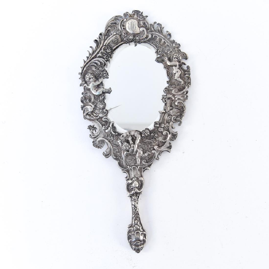 EARLY STERLING SILVER REPOUSSE VANITY HAND MIRROR: Dimensions: H 12" x W 5" Condition: Showing light signs of age, crack in mirror.