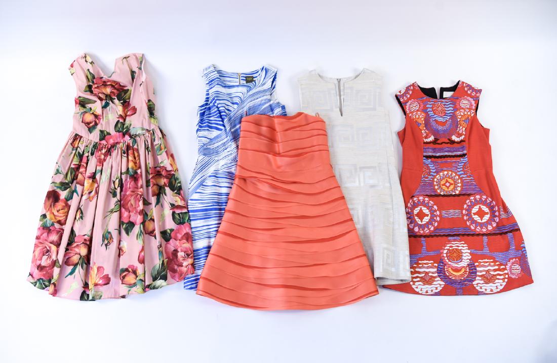 GROUPING OF (5) LADIES DESIGNER DRESSES: Including: Size 8 Taylor brand, Dolce & Gabbana size 46 pink floral, Roland Nivelais 100% silk strapless, Peter Pilotto size 12, and a Tory Burch size 6 Greek key pattern. Condition: Used. Showing lig