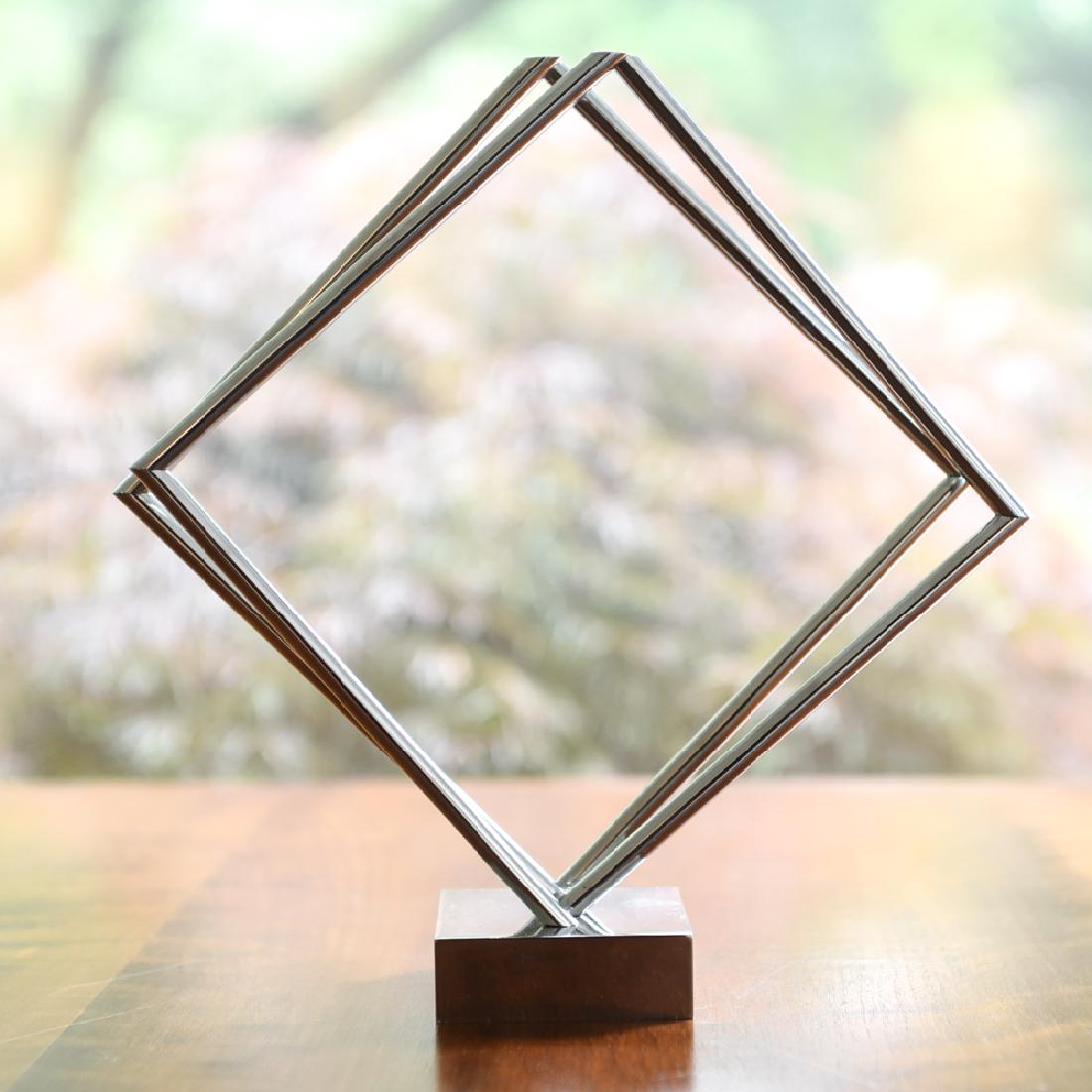 YAACOV AGAM 1970 KINETIC SCULPTURE: Marked on base. Dimensions: H 10.5" x W 6.5" x D 2.75" Condition: Light handling wear.