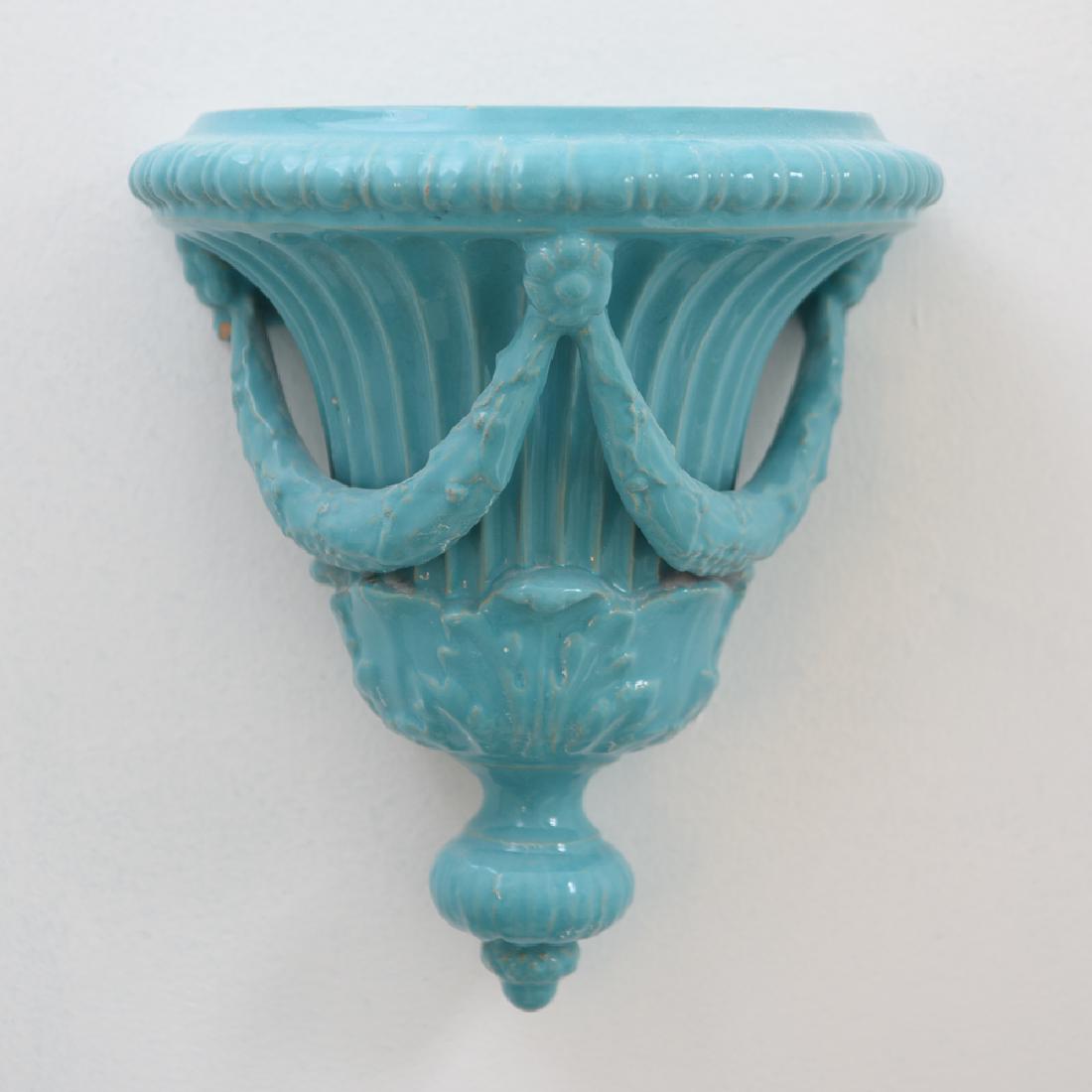 TURQUOISE GLAZED CERAMIC WALL BRACKET SHELF: Signed inside, made in Italy. Dimensions: H 10.5" x W 9.5" x D 6.5" Condition: A few glaze nicks.