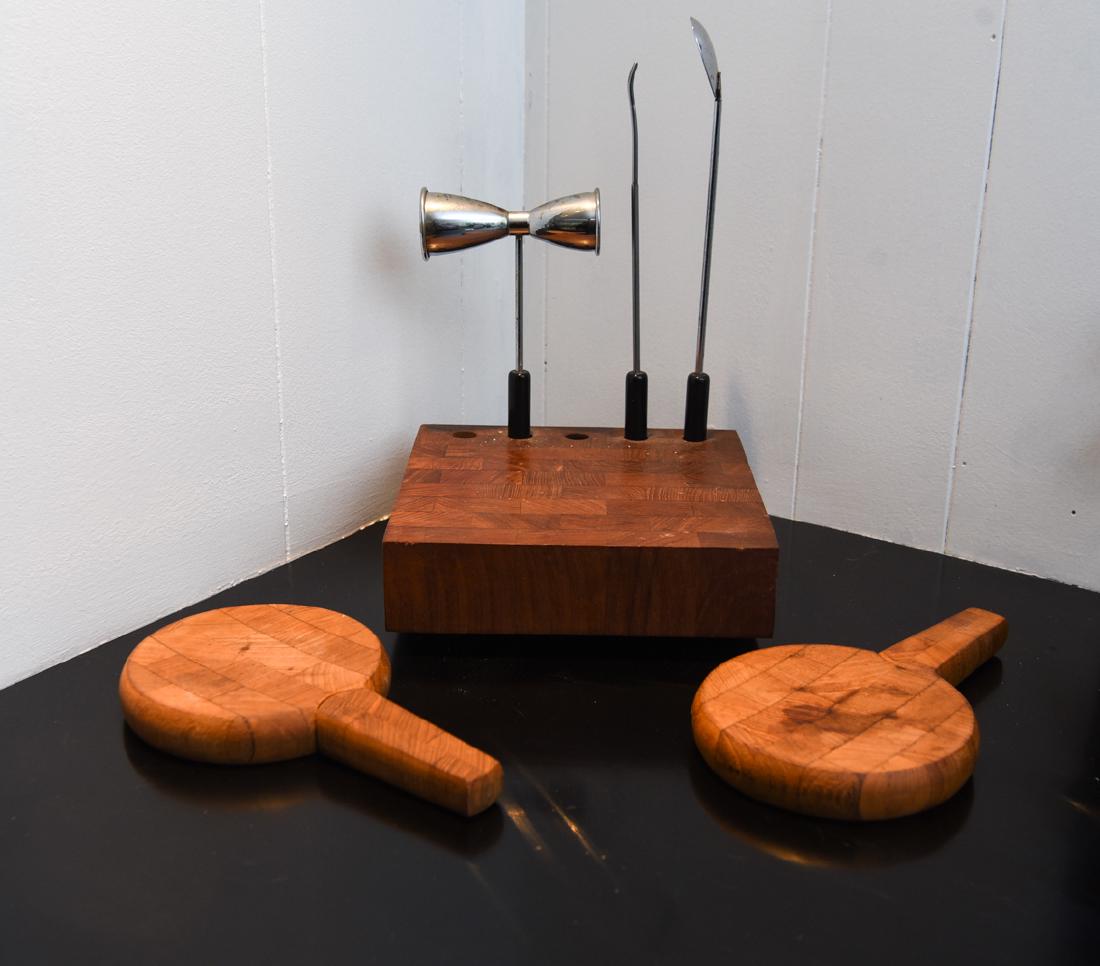 MODERN WOODEN BAR & CHEESE SET INCL. DANSK: Two cheese platters and barware set. Dimensions: (Barware base) H 2.75" x W 8" x D 8" Condition: Incomplete set. Showing signs of use.