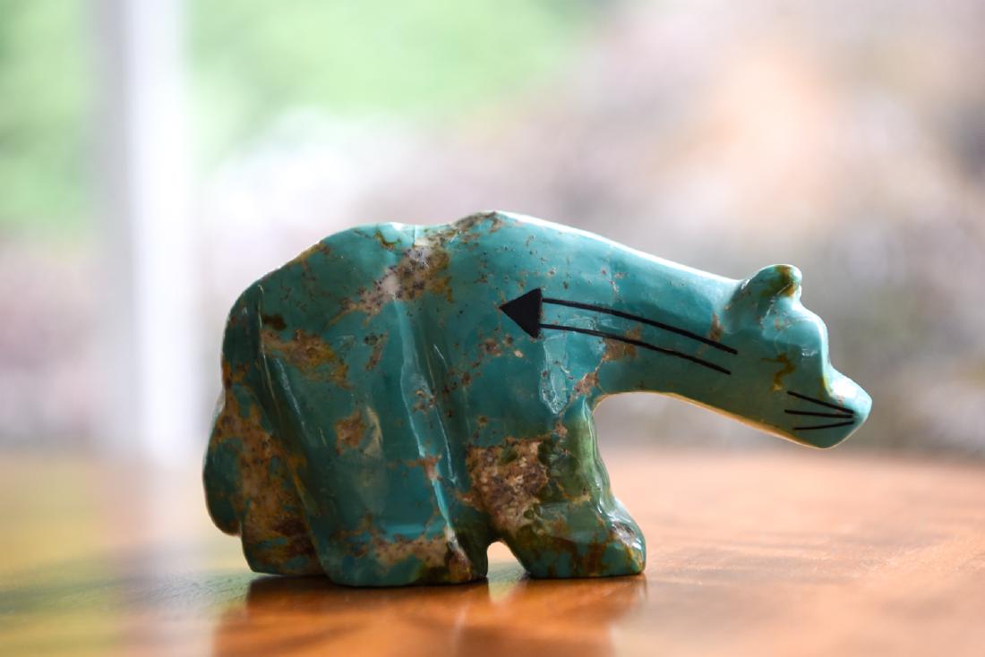 ZUNI MOUNTAIN LION FETISH: Large size, possibly turquoise. Dimensions: H 3" x W 5.5" x D 1.5" Condition: Few small chips to base edge.