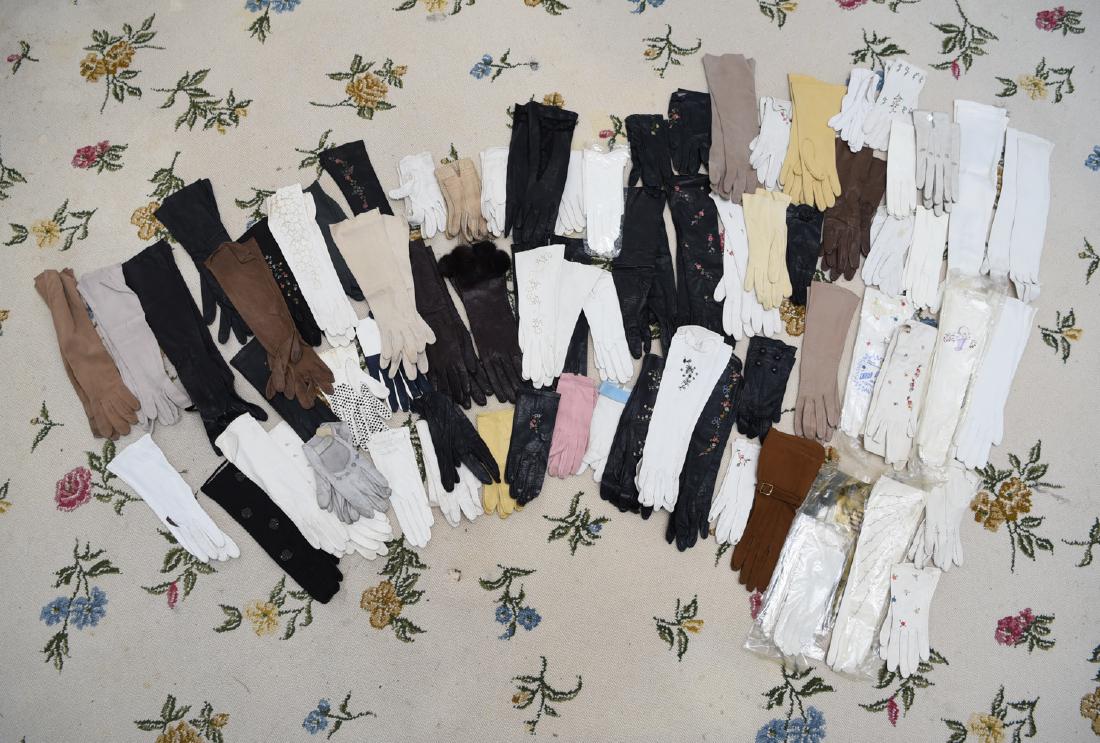 LARGE COLLECTION OF VINTAGE & ANTIQUE GLOVES: Many calf skin with embroidery. Small sized hand. Dimensions: (Longest) L 14" Condition: Used, showing light signs of age and use.