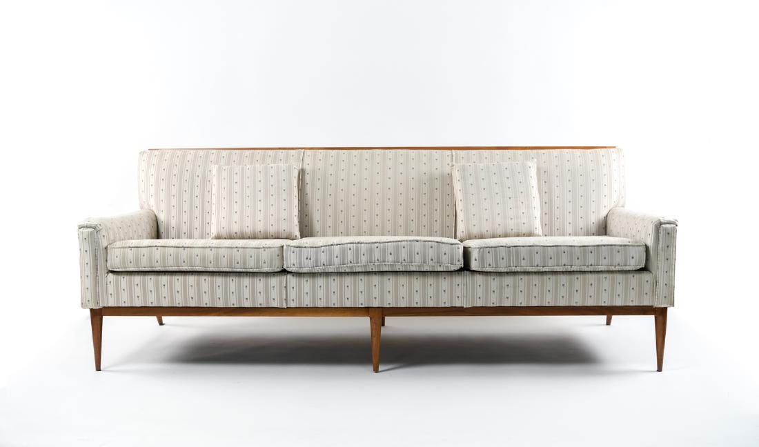 ATTR. PAUL MCCOBB MID-CENTURY THREE SEAT SOFA: Dimensions: H 31" x W 81" x D 31" x SH 19" Condition: Few spots and stains to upholstery. Light wear to wood.