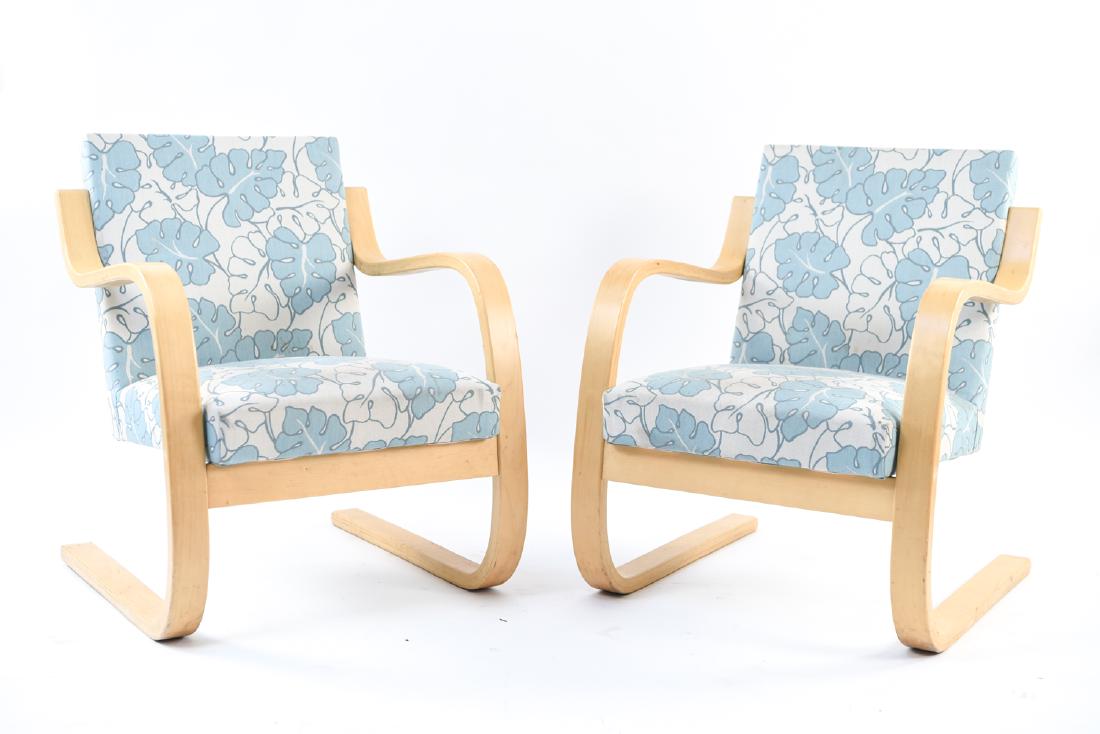PAIR ALVAR AALTO CANTILEVER LOUNGE CHAIRS: Dimensions: H 30" x W 23.5" x D 26" x SH 15" Condition: Staining, some fraying to fabric, scratches and nicks to frame.