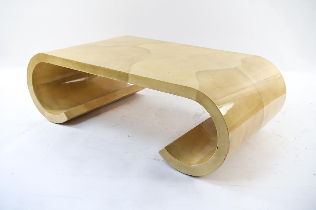 ATTR. KARL SPRINGER PARCHMENT COFFEE TABLE: Dimensions: H 15.5" x W 48" x D 26" Condition: Scuffs, scratches, nicks, and dings. Few minor losses. Wear consistent with age and use.