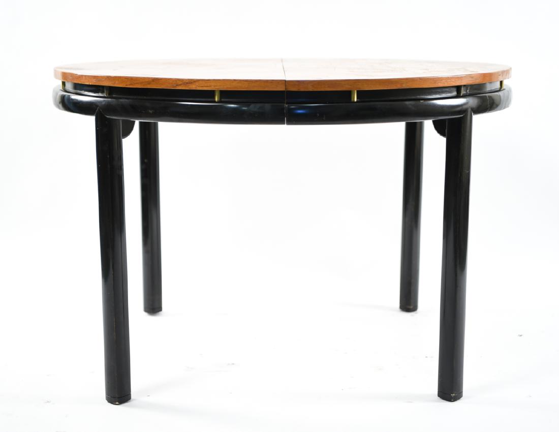 MID-CENTURY MICHAEL TAYLOR FOR BAKER DINING TABLE: Includes one 18" leaf. Dimensions: (Without leaf) H 26.5" x Dia. 39.5" Condition: Finish wear and loss. Marks, scuffs, and scratches throughout.