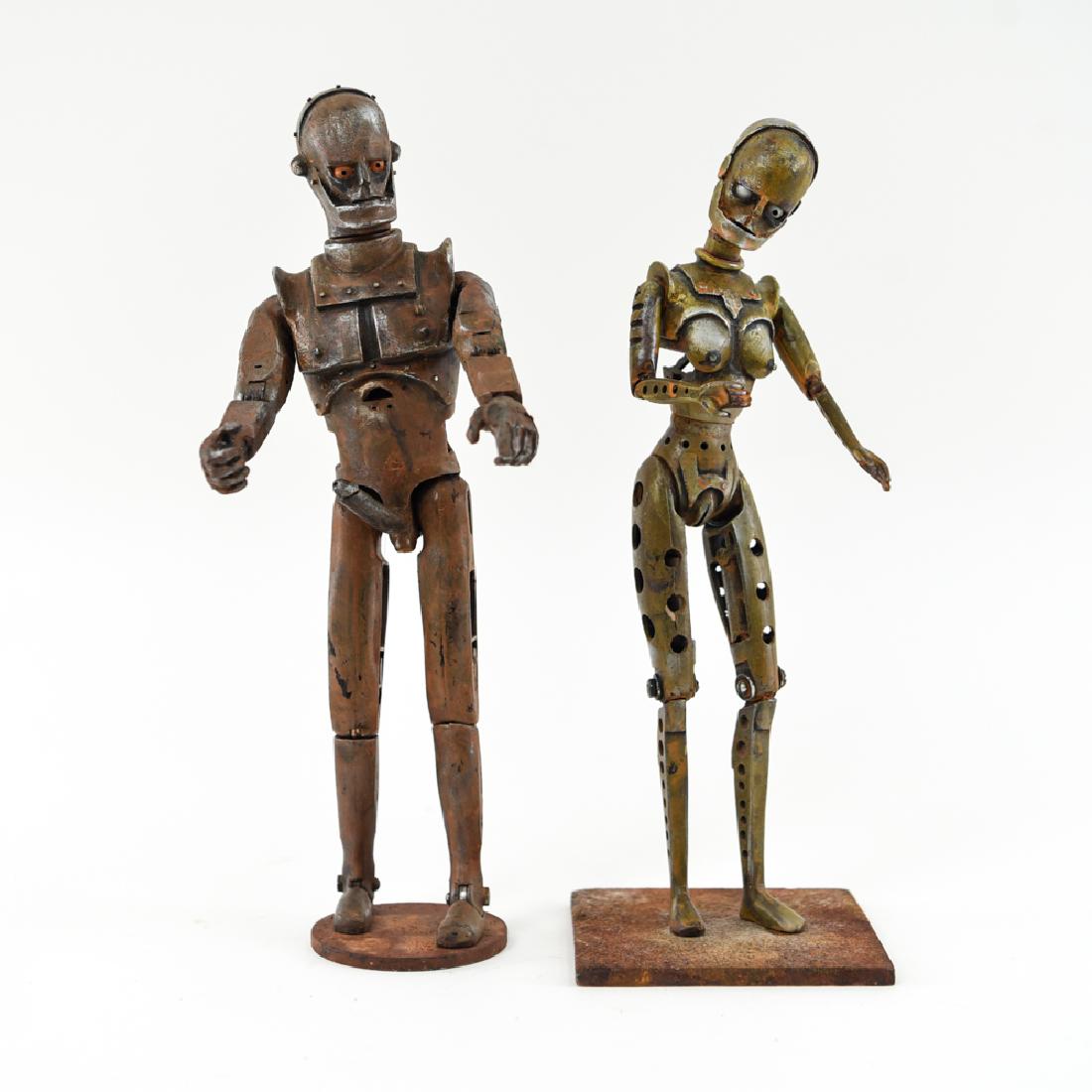 (2) MICHAEL SULLIVAN EROTIC ROBOT SCULPTURES: Signed underneath: Michael Sullivan. One dated 2012, one titled "Sex Life of Robots" underneath. Carved from Barbie dolls. Dimensions: (Male) H 12.5" x W 5" x D 3" Condition: No issues to note.