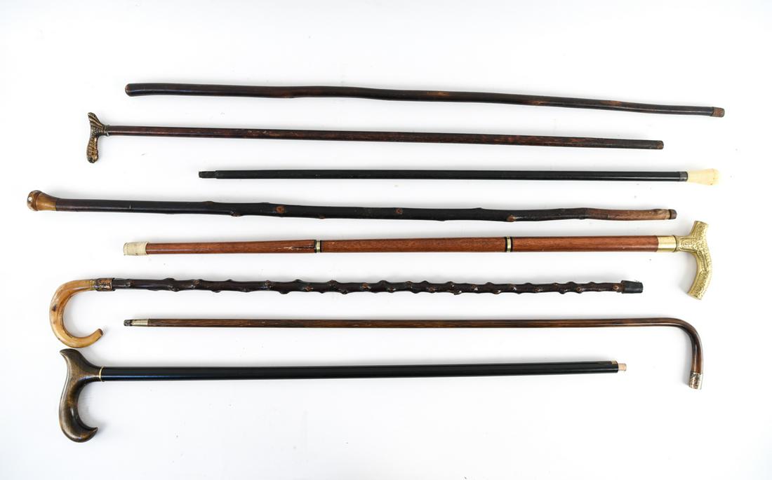 GROUPING OF CANES: (7) pieces. Dimensions: (Tallest) H 39" Condition: All showing wear consistent with use. Few small losses.