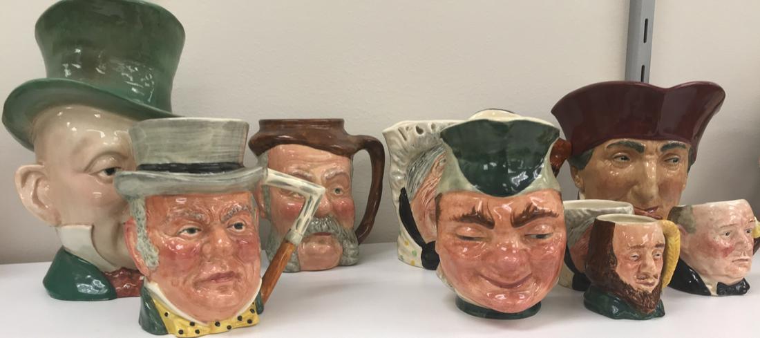 GROUPING OF TOBY JUGS: (9) pieces. Including some Royal Doulton, mostly English. Dimensions: (Largest) H 9" x W 6.5" x D 8" Condition: Showing signs of age including crazing, one with losses. Small losses to paint.