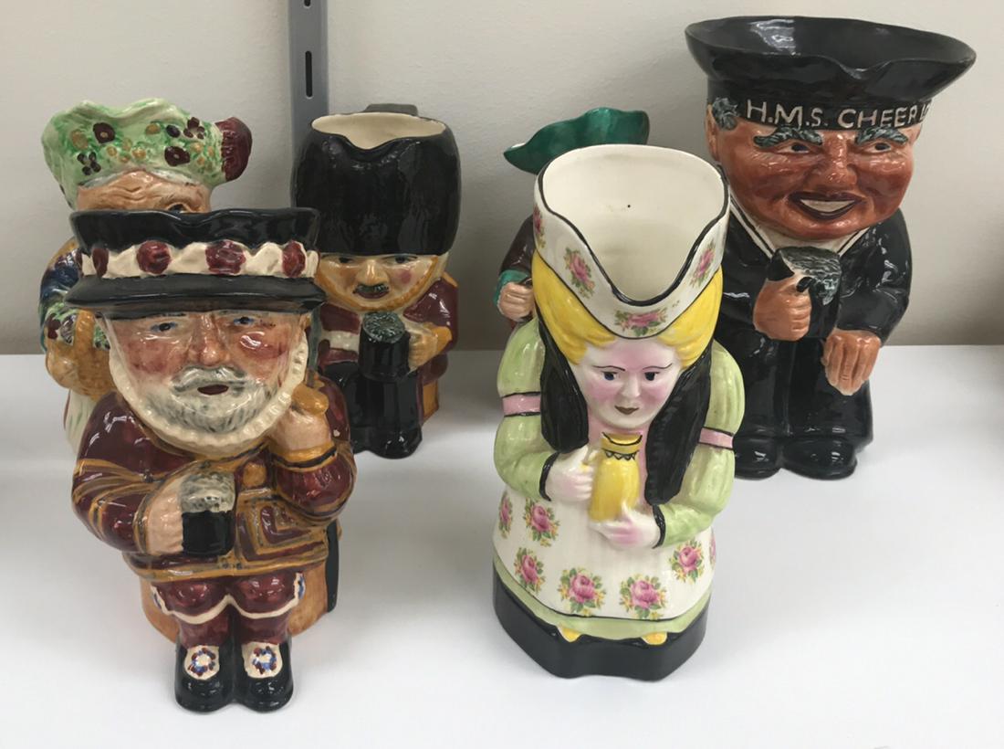 GROUPING OF TOBY JUGS: (6) pieces, royal doulton style. Dimensions: (Largest) H 8.5" x W 7" x D 5.5" Condition: Showing signs of age.