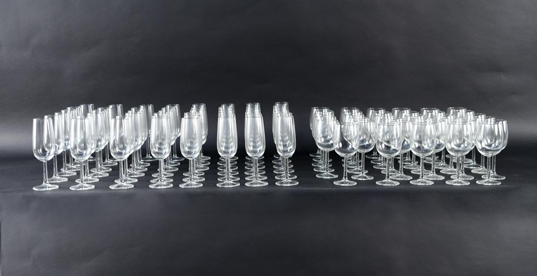 LARGE GROUPING OF STEMWARE: Tagged underneath: The Netherlands. Dimensions: (Champagne) H 7.5" x Dia. 2.5", (Wine) H 6.5" x Dia. 2.5" Condition: Light wear from use.
