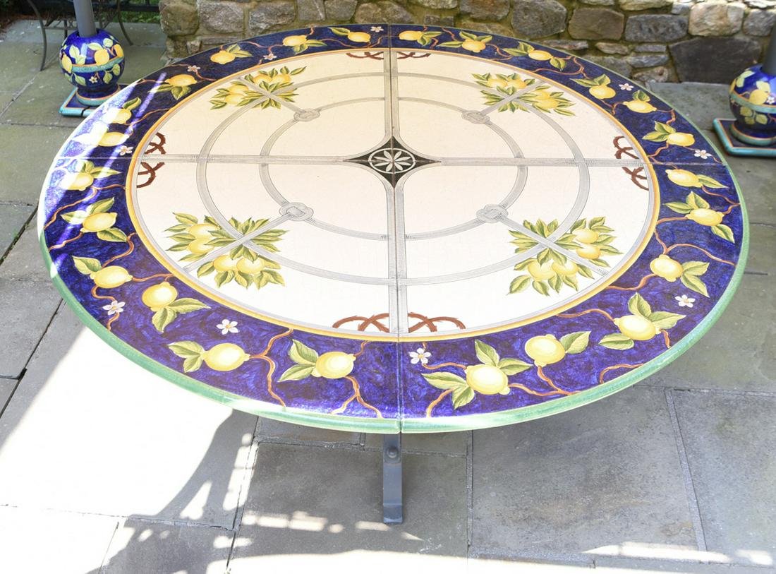 ITALIAN IRON AND CERAMIC TILE OUTDOOR TABLE: Measures: 30" H x 71" diameter Condition: wear consistent with use, good condition