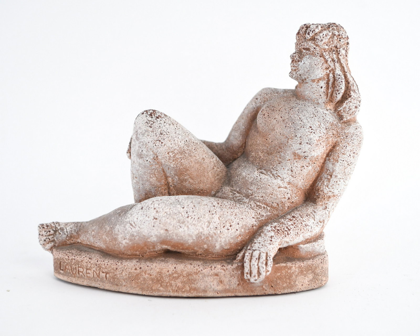 ROBERT LAURENT (1890-1970) SCULPTURE: Reclining nude, cast stone. C. 1939. Inscribed on base LAURENT / ROBINSON GALLERIES INC / NEW YORK CITY. Dimensions: H 7.5" x W 9" x D 4" Condition: Varied surface.