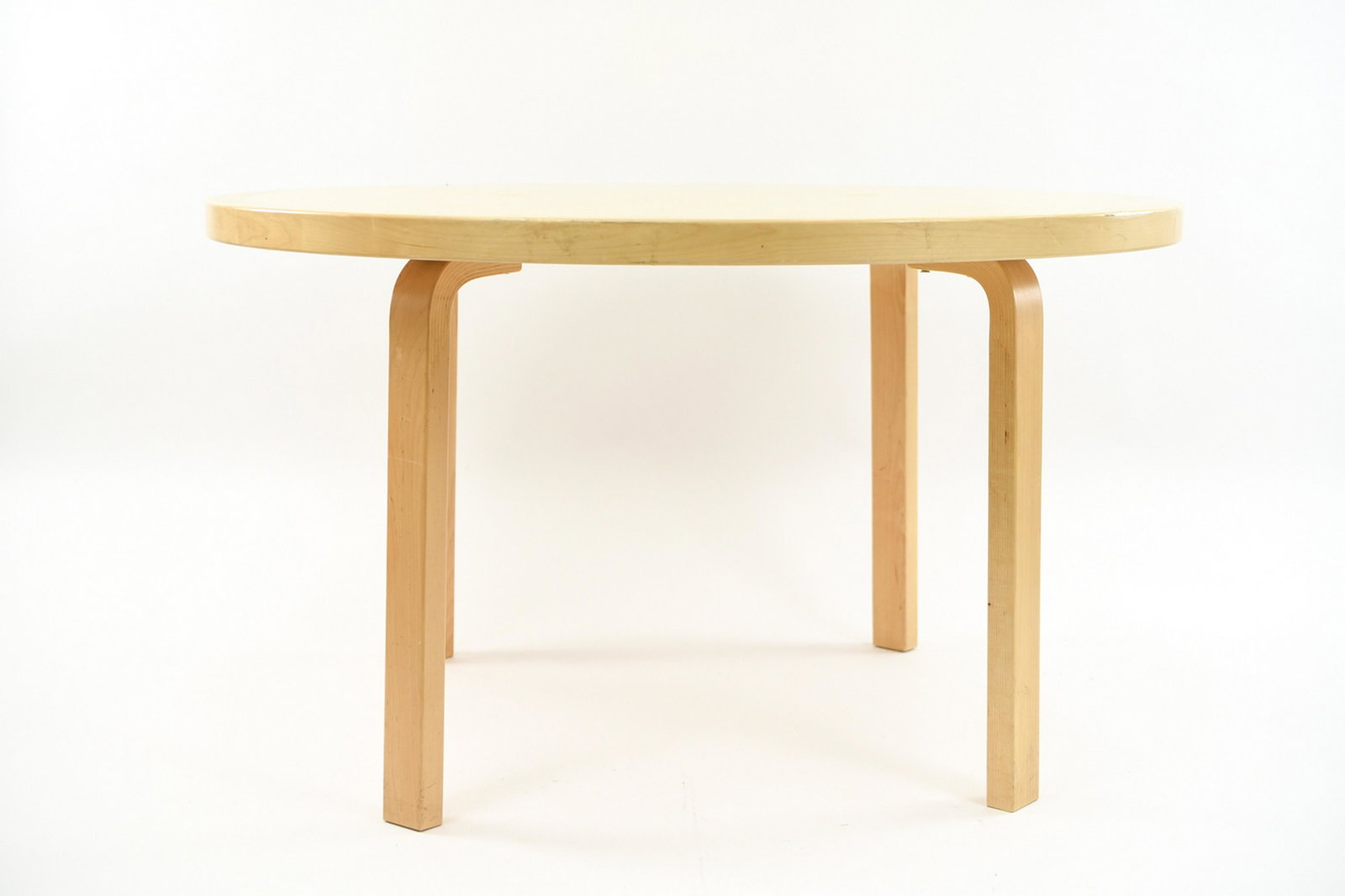 ALVAR AALTO ICF DINING TABLE: Marked ICF underneath. Dimensions: H 28" x Dia. 49" Condition: Some screws not original and not fitting properly, needs new hardware. Some light scratches and surface nicks, including some flaking to 