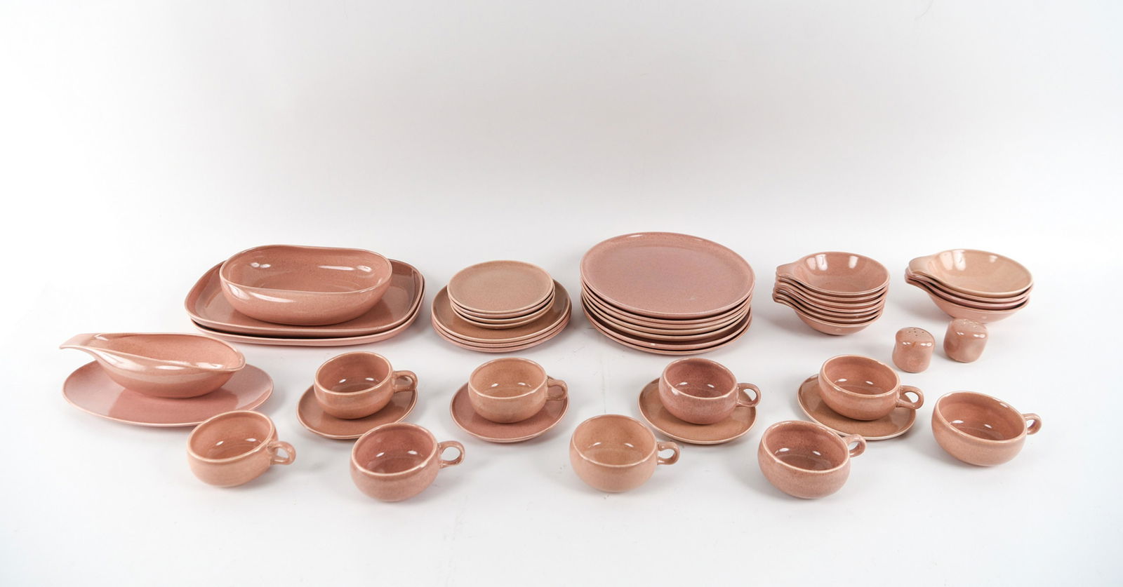 RUSSEL WRIGHT CERAMIC GROUPING: Marked underneath: Russel Wright. Dimensions: (Platter) H 1.25" x W 13.5" x D 9" Condition: Glaze skips and few surface blemishes to several pieces.