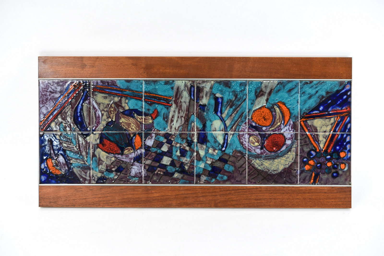 HARRIS G. STRONG MID-CENTURY CERAMIC TILE ART: Label verso. Dimensions: (Overall) H 17.5" x W 36.5" Condition: Light finish wear to wood.