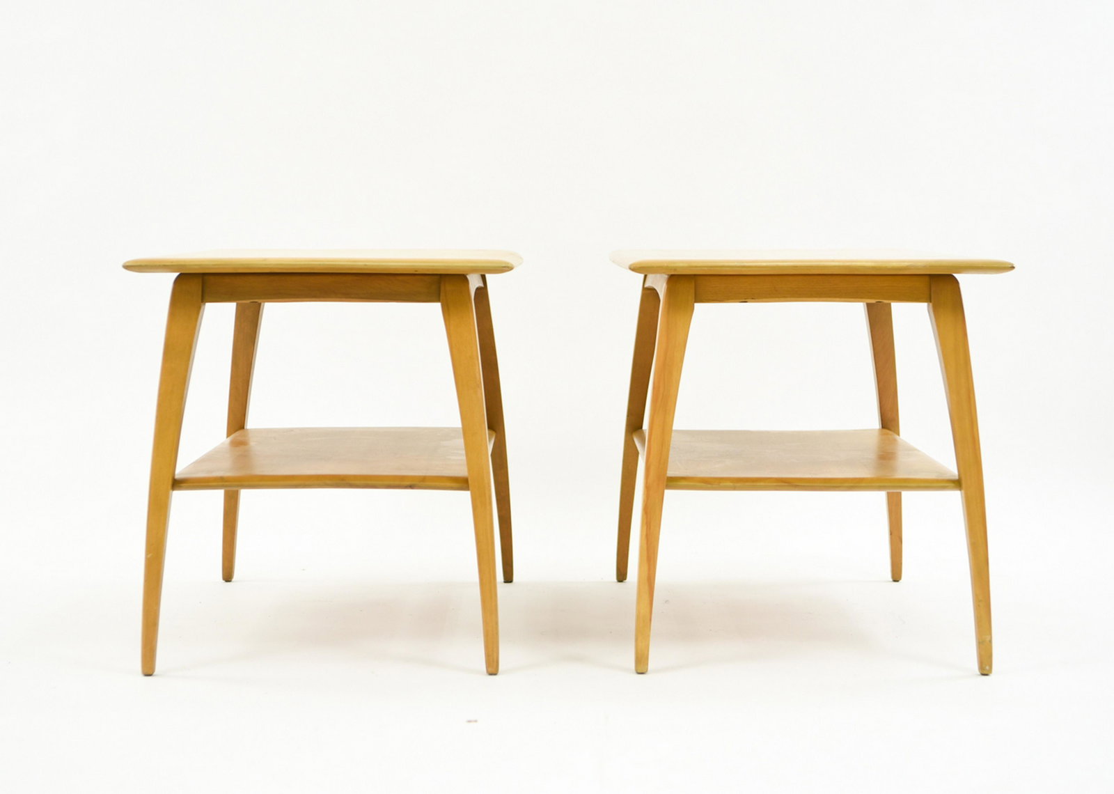 PAIR OF HEYWOOD-WAKEFIELD SIDE TABLES: Stamped underneath Dimensions: H 21" x W 30" x D 19.5" Condition: Few marks and light surface scrapes. Rubs to the legs.