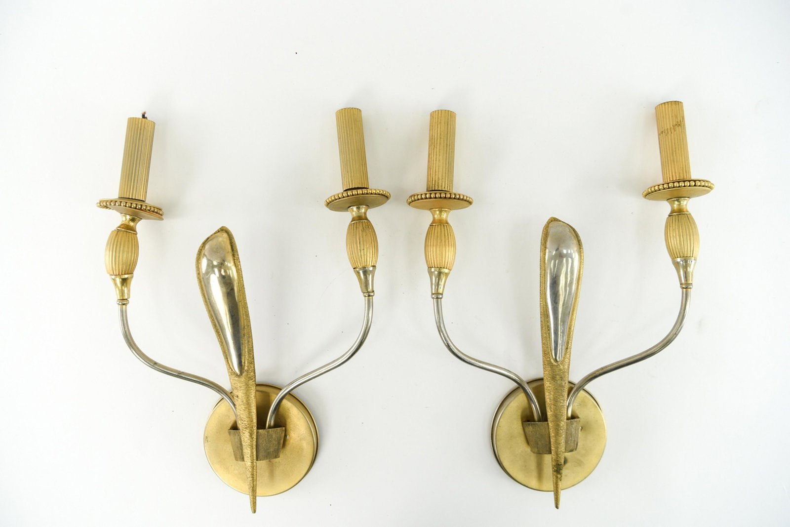 PAIR OF MID-CENTURY BRASS SCONCES: Dimensions: H 17" x W 12" Condition: Some corrosion to metal, surface scratches, small dents, and loss to plating.