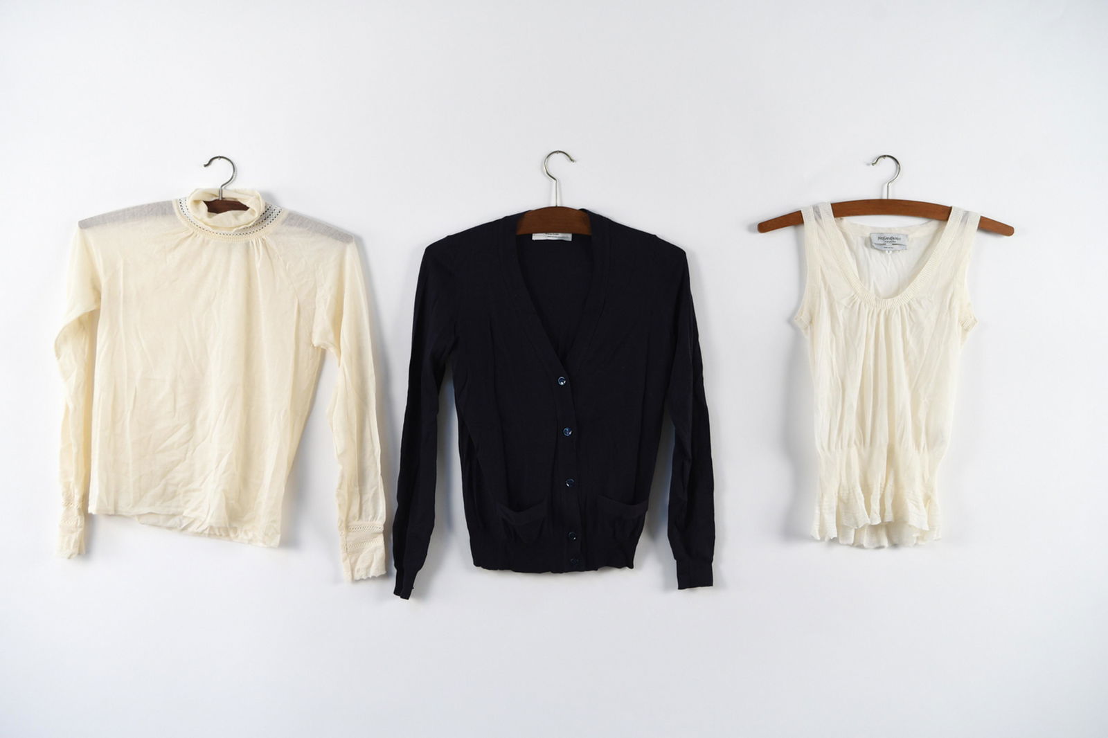 YVES SAINT LAURENT LADIES DESIGNER TOPS: 3 YSL cashmere or wool blend tops. Size: Small Condition: Used, showing no obvious signs of use.