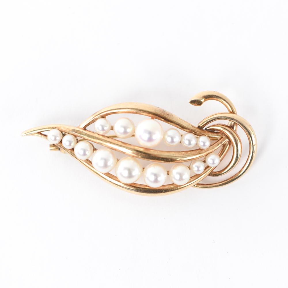 MIKIMOTO PEARL & 14K GOLD BROOCH: Hallmarked K. Mikimoto Tokyo 14K. Dimensions: L 2" x W 4" Weight: 9.7 grams Condition: Bend to pin back. Minimal surface scratches due to use