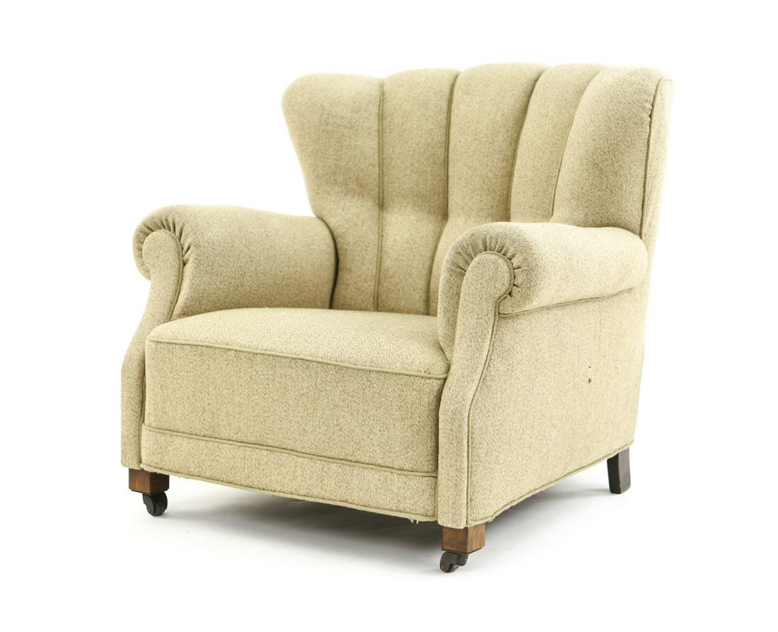 FRITZ HANSEN MODEL 1518/1519 DANISH EASY CHAIR: With front casters. Dimensions: H 33" x W 36" x D 36" x SH 14.5" Condition: Joints slightly loose. Couple very small marks to upholstery. F058