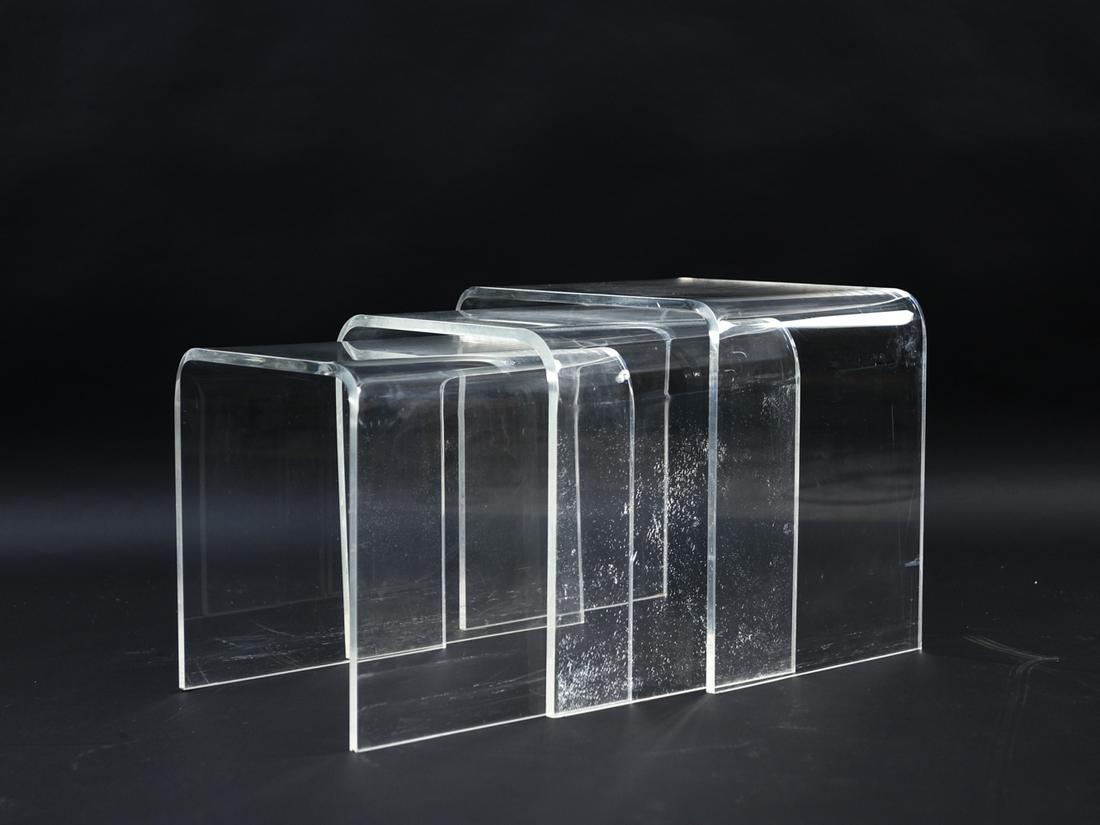 (3) ACRYLIC NESTING TABLES, C. 1970S: Dimensions: (Largest) H 17" x W 18.25" x D 14" Condition: Chip to edge of largest. Crazing to lucite. Some surface scratches.