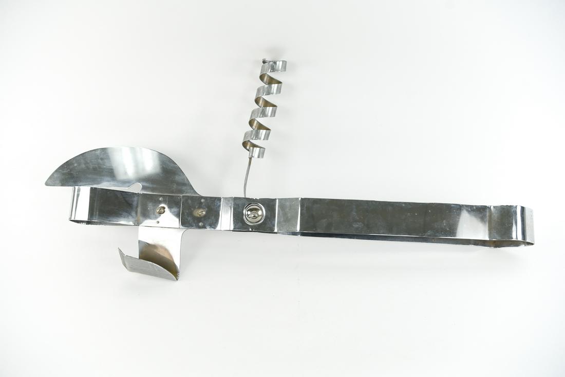 CURTIS JERE GIANT CAN OPENER / CORK SCREW: Unsigned. Dimensions: L 48" x W 13"x D 6 Condition: Showing finish wear and some dings.