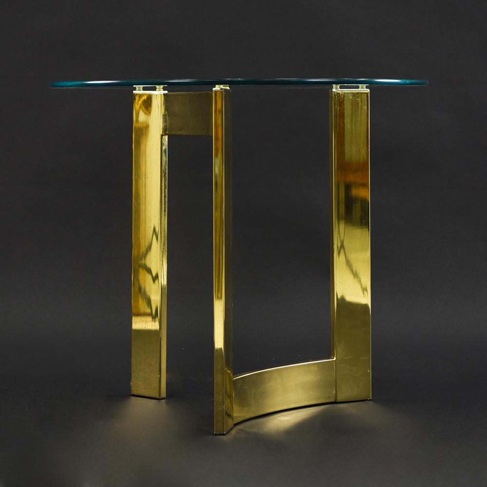 BRASS & GLASS SIDE TABLE: Dimensions: H 22.75" x D 26" Condition: Scratches and light finish wear consistent with age and use.
