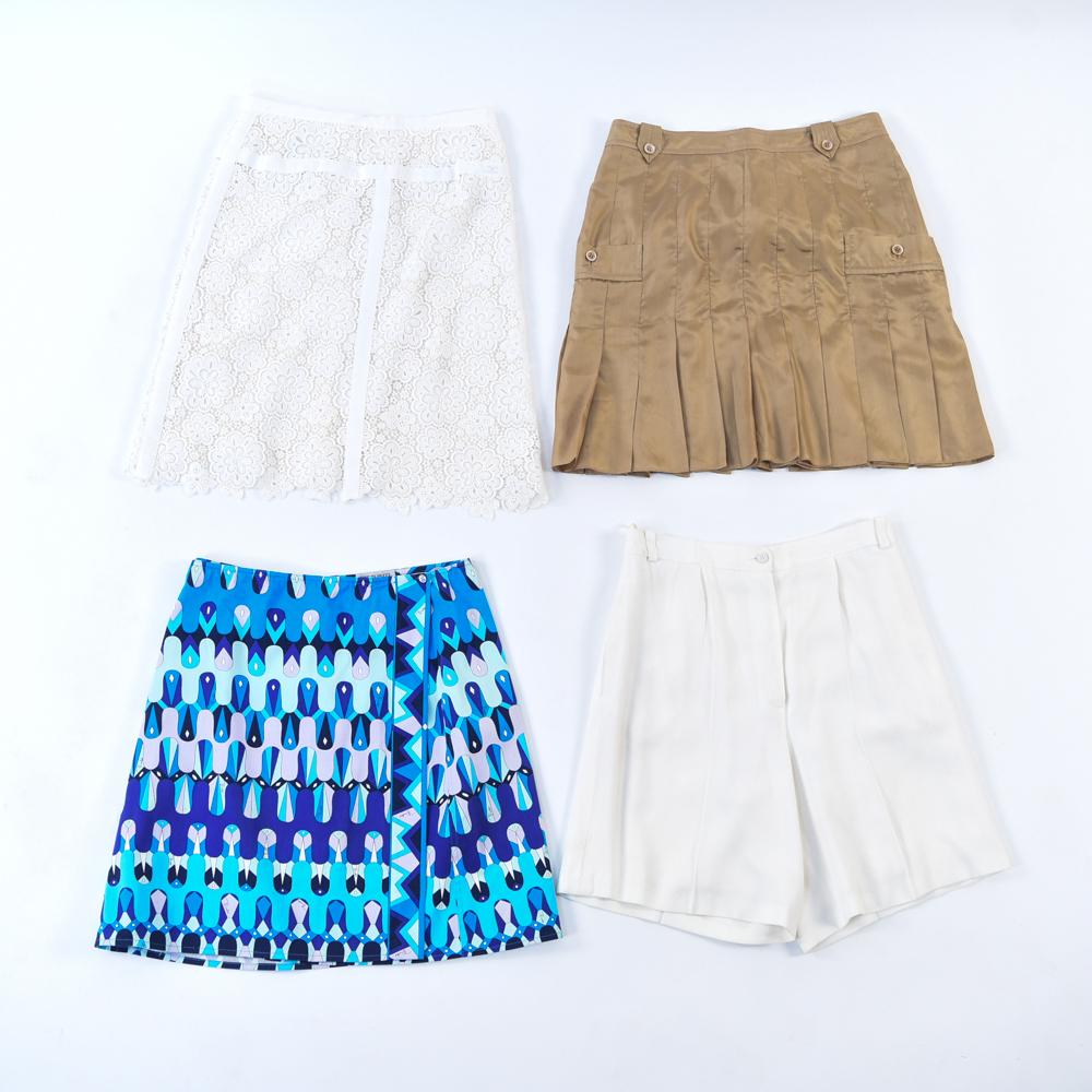 (4) LADIES DESIGNER BOTTOMS: Pair of Chanel white shorts, Chanel white eyelet lace skirt (size 38), Yves Saint Laurent silk skirt, Emilio Pucci wrap around skirt. Condition: Used, showing very light signs of use.