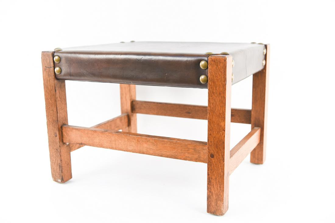 STICKLEY OAK AND LEATHER OTTOMAN: Dimensions: H 15" x W 20.5" x D 16.5" Condition: Some staining to leather. Overall light wear consistent with age and use.