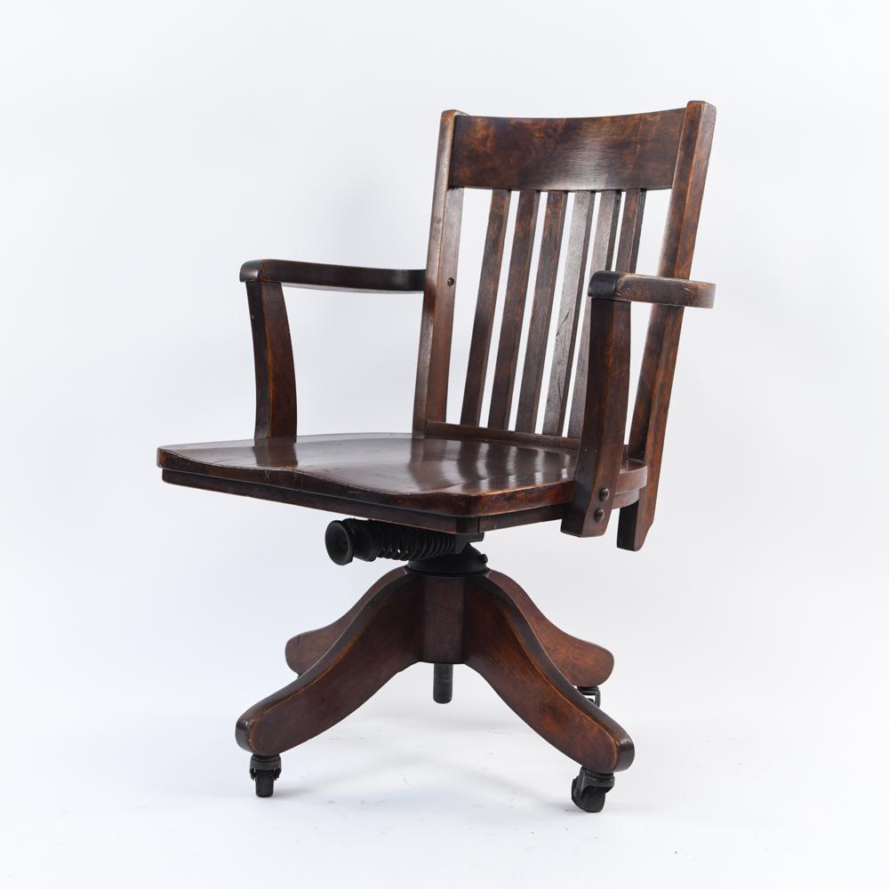 WOODEN OFFICE DESK CHAIR: Dimensions: H 34" x W 24" x W 18.5" x SH 16" Condition: Wear consistent with age and use. Some finish loss, nicks, and dings.