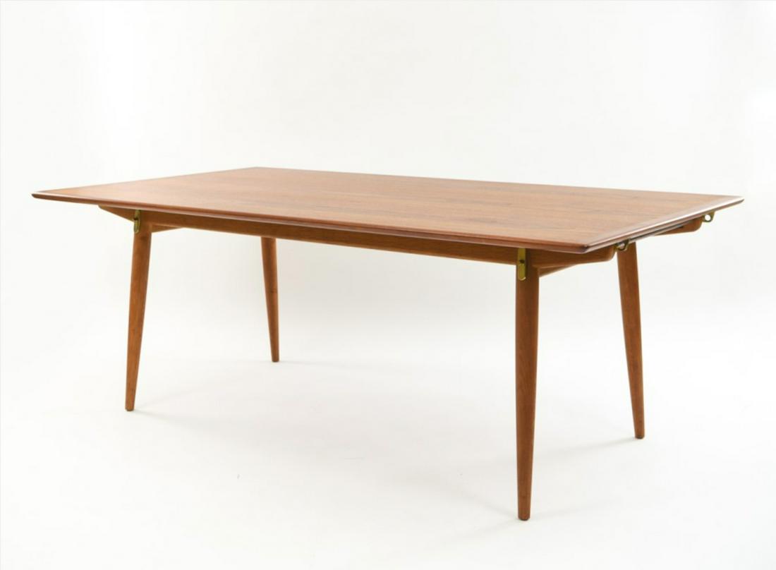 HANS WEGNER JH570 EXTENSION DINING TABLE: Marked Johannes Hansen under. Including custom made table pads. Single owner. Dimensions: H 28.75" x W 70.5" (W including both leaves: 106.5") x D 39.25" Condition: Showing overall light signs of use.
