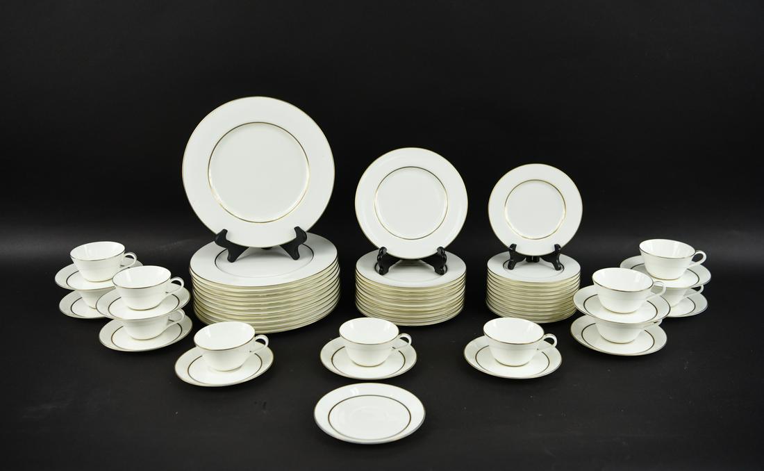 TIFFANY PORCELAIN DINNER SERVICE FOR 12: Including: (12) dinner plates, (12) salad plates, (12) dessert plates, (12) saucers, (11) cups.Dimensions: (Dinner plate) D 10.5"Condition: Showing light signs of use.