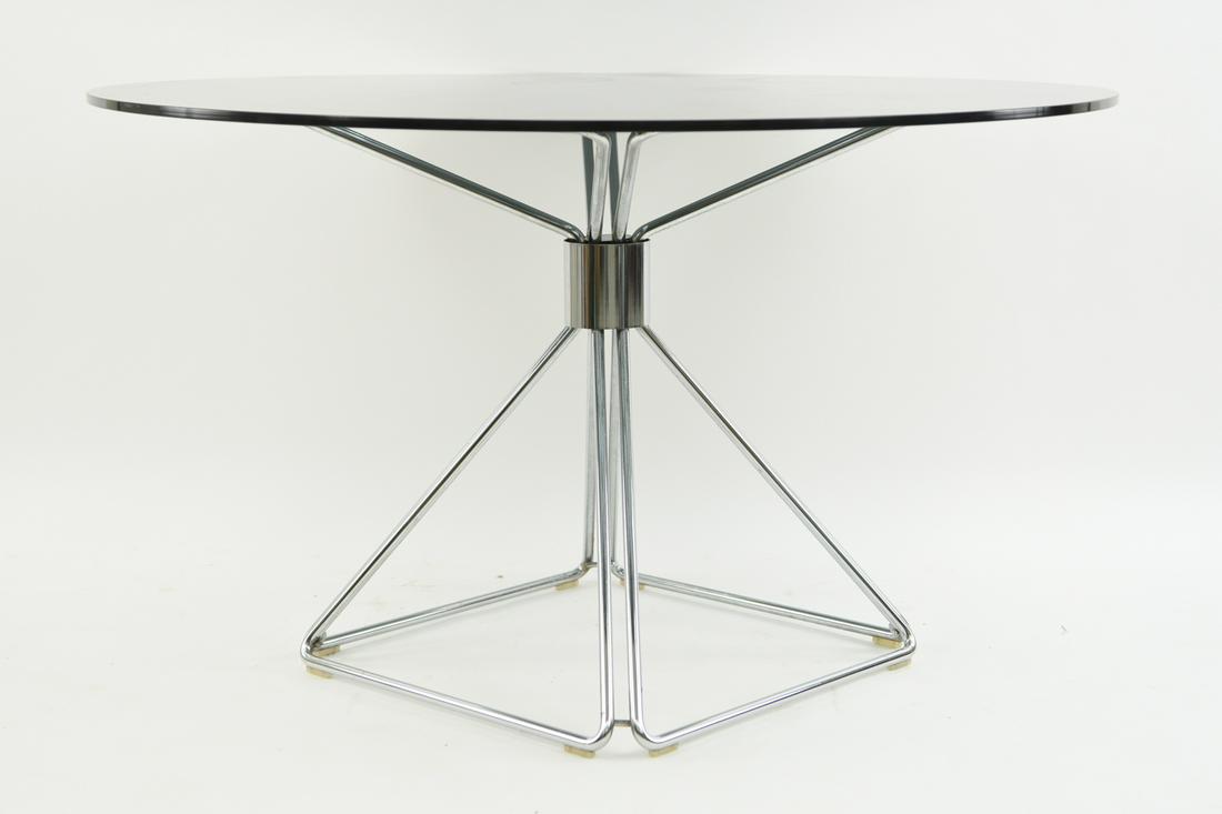 RUDI VERELST FOR NOVALUX DINING TABLE: Dimensions: H 28.75" x D 48" Condition: Showing overall light wear. Areas with light finish wear to base. Few light surface scratches to glass.
