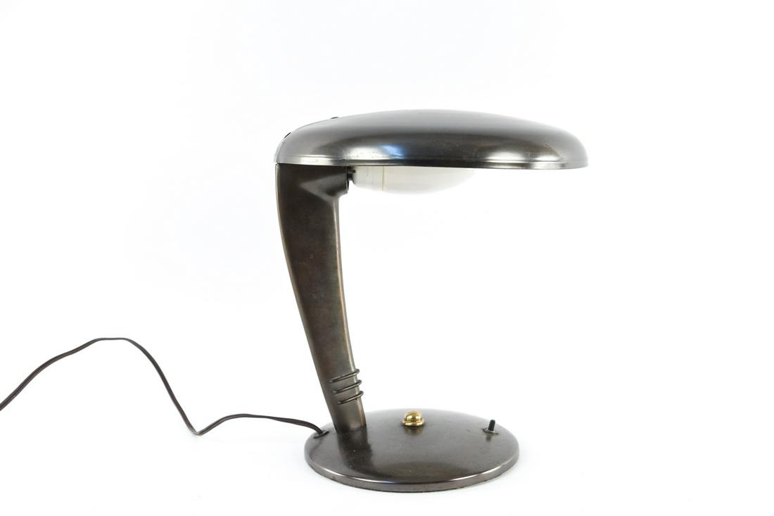 NORMAN BEL GEDDES COBRA TABLE LAMP: Unmarked. Dimensions: H 12" x W 11.25" x D 11.5" Condition: Some tarnish and surface wear.