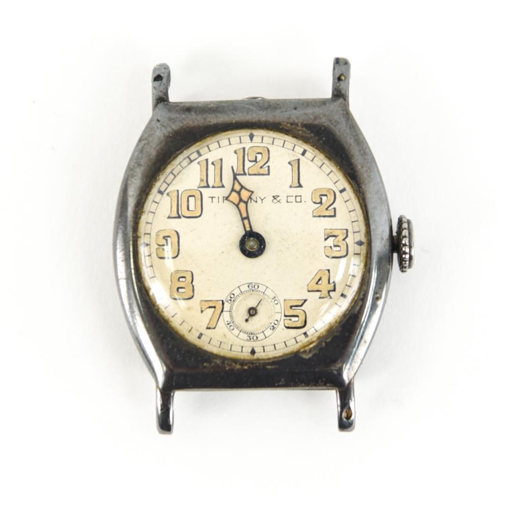 TIFFANY & CO/LONGINES DECO STERLING SILVER WATCH: Inside of case marked: "Longines, sterling silver and 3935138. Movement with Longines and same number, 14 jewels. Face marked Tiffany & Co Dimensions: H 1.5" x W 1.25" Condition: movement needs work, 