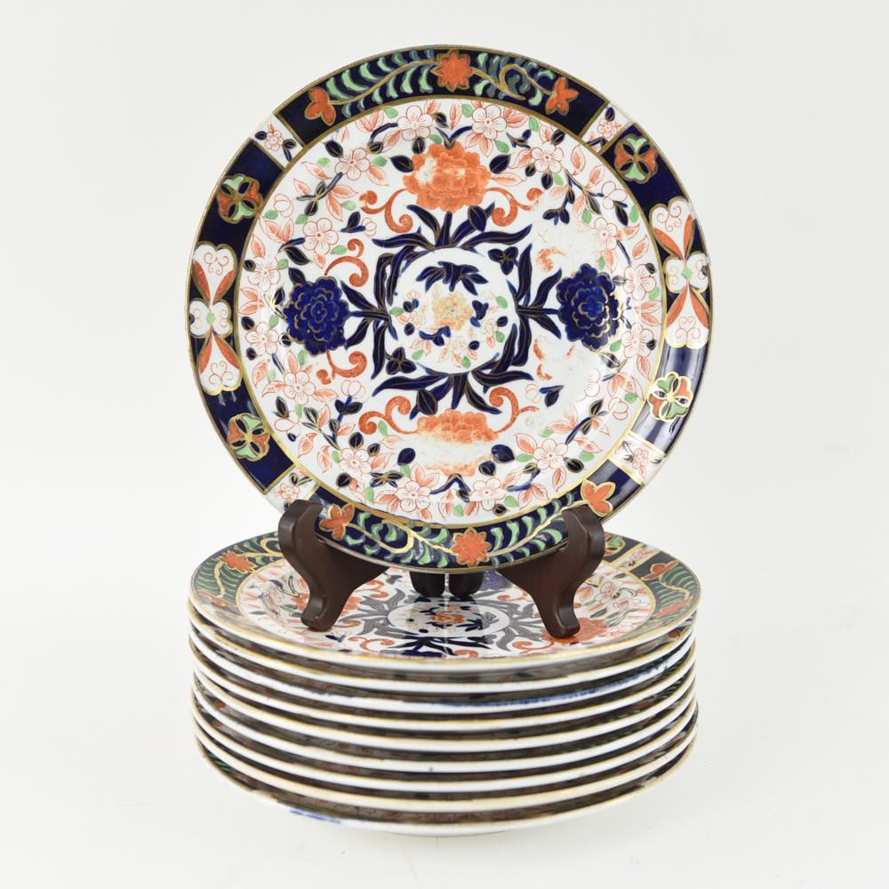 (10) ROYAL CROWN DERBY IMARI PATTERN PLATES: Marked underneath. Dimensions: Dia. 9" Condition: Crazing, surface wear to paint decoration and gold. Some with old chips/chip repairs. Few surface imperfections in the porcelain.