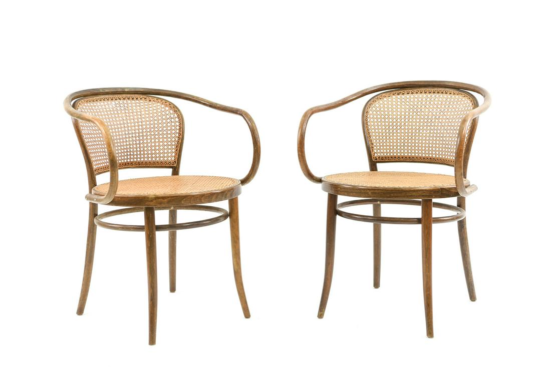 CZECH BENTWOOD ARMCHAIRS: with made in Czechoslovakia paper label under. Dimensions: H 31" x W 23" x D 25" Condition: signs of use to arms. light denting to caning on one, one with fragile caning.