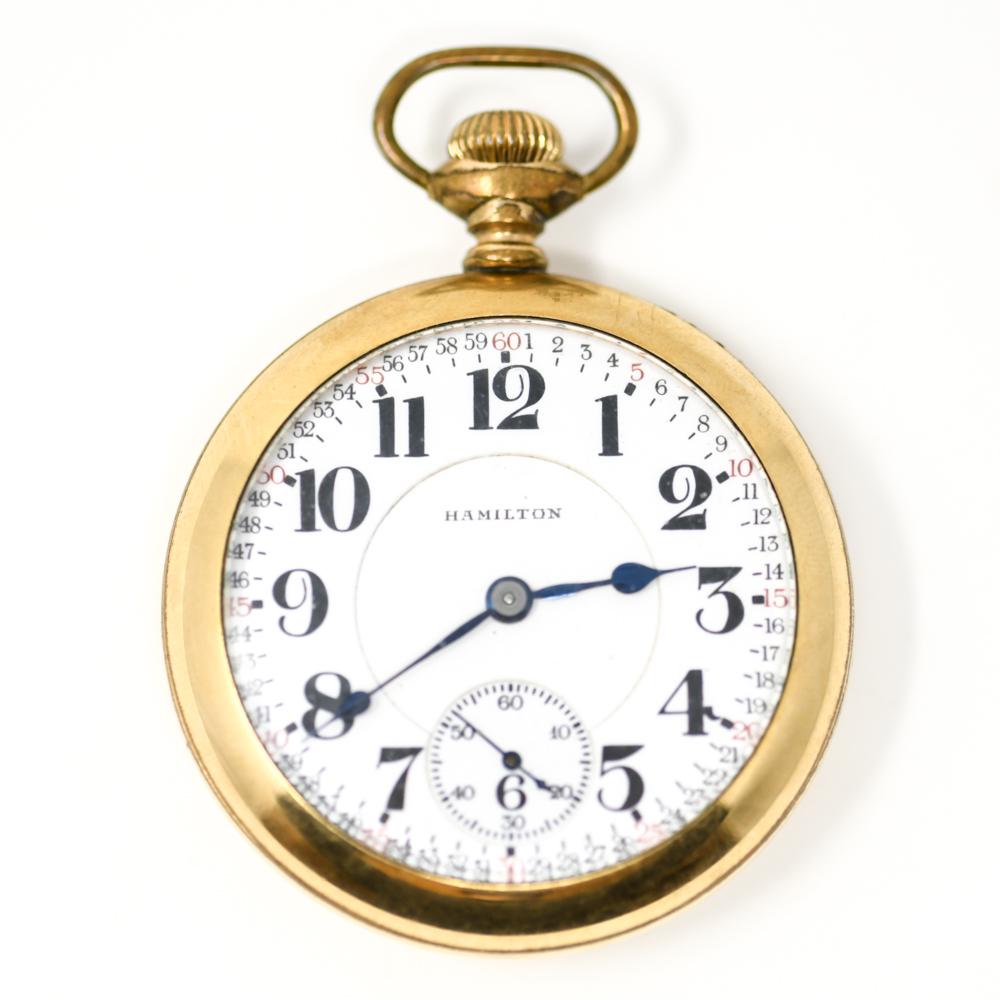HAMILTON GOLD FILLED POCKET WATCH: Case numbered 9840504 and marked Scepter. Movement marked Hamilton Watch Co. Motor Barrell, 21 jewels, double roller, numbered 1447594. Dimensions: 54 mm Weight: (Overall) 72.7 dwt. Condition: Winds a