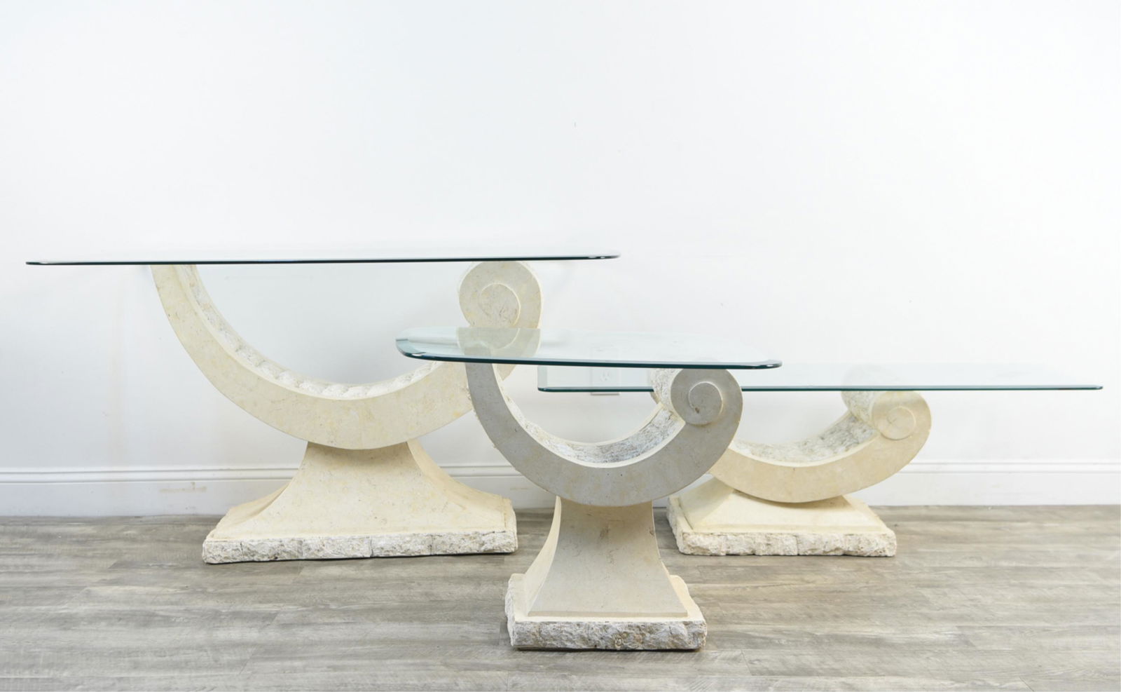 (3) ITALIAN TESSELLATED TRAVERTINE MARBLE TABLES: Dimensions: (Largest) H 28.25" x W 51" x D 29" Condition: Surface scratches and flea bites to glass. Wear consistent with age and use.