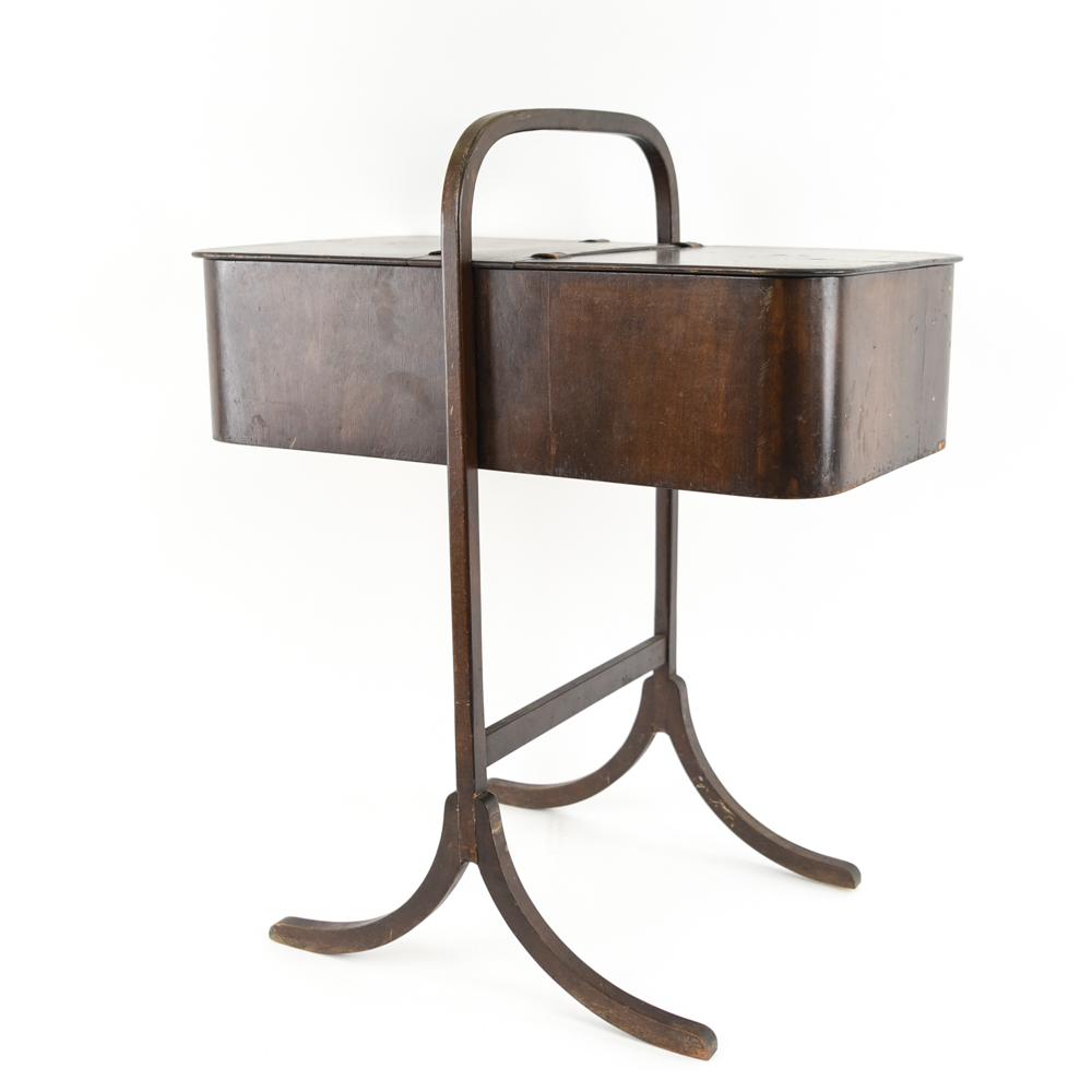 FRITZ HANSEN 1940 SEWING BOX: Dimensions: H 27" x W 22" x D 13.5" Condition: Repair to one side of base. Showing wear consistent with age and use. Leather hinges slightly dry and cracked. F046