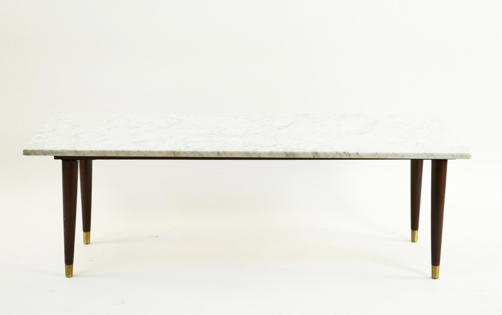 MID-CENTURY MARBLE COFFEE TABLE: Dimensions: H 16" x W 48" x D 20" Condition: Chips to edges of marble. Some tarnish to brass foot caps. Marks to wood legs.