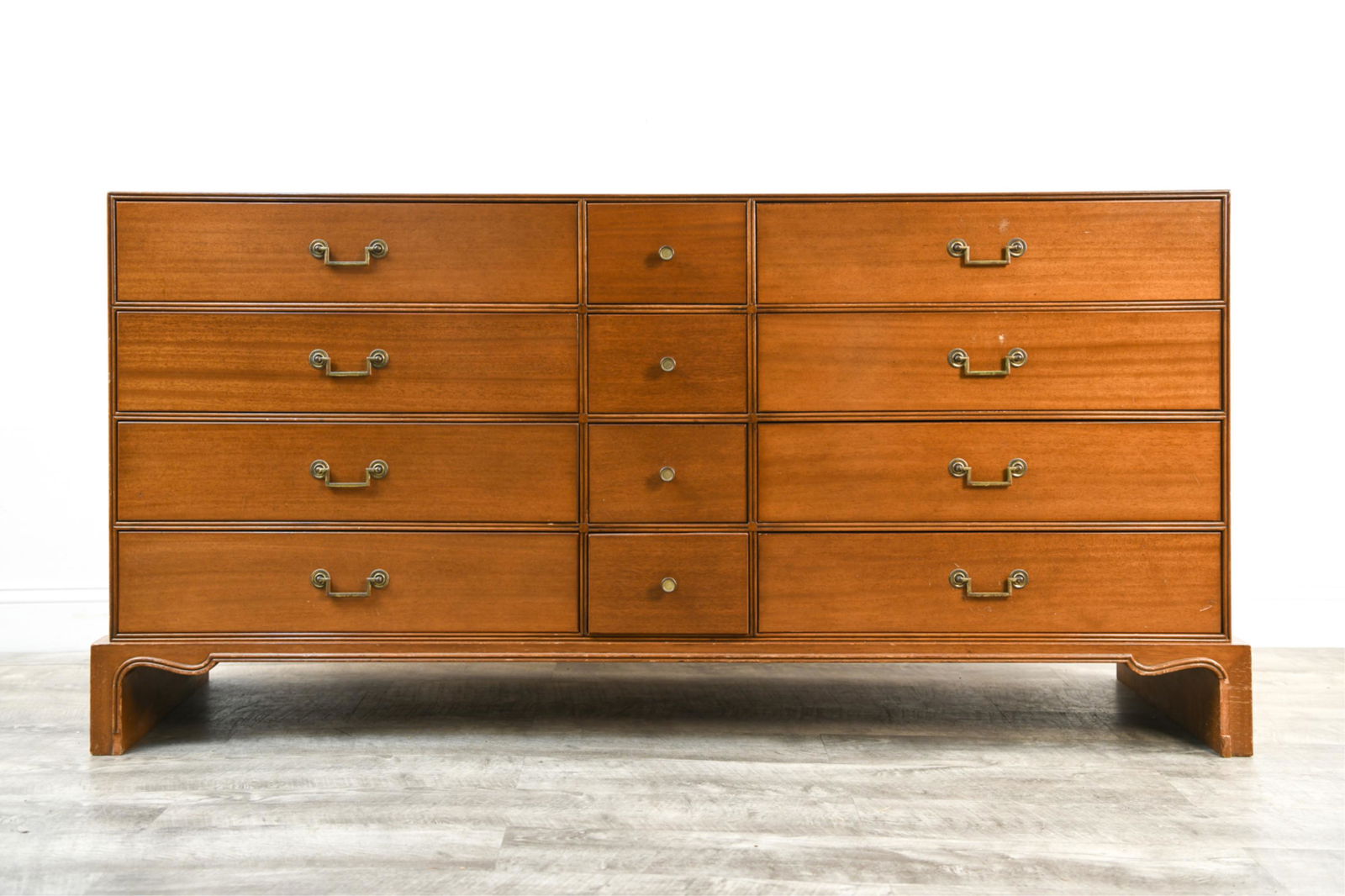 MID-CENTURY CHARAK DRESSER MANNER OF PARZINGER: Marked Charak Modern in drawer.Dimensions: H 33" x W 66.25" x D 17.5"Condition: Chipping and losses to veneer. Nicks and dings to edges. Scratches and scuffs throughout. Showing wear throughout.