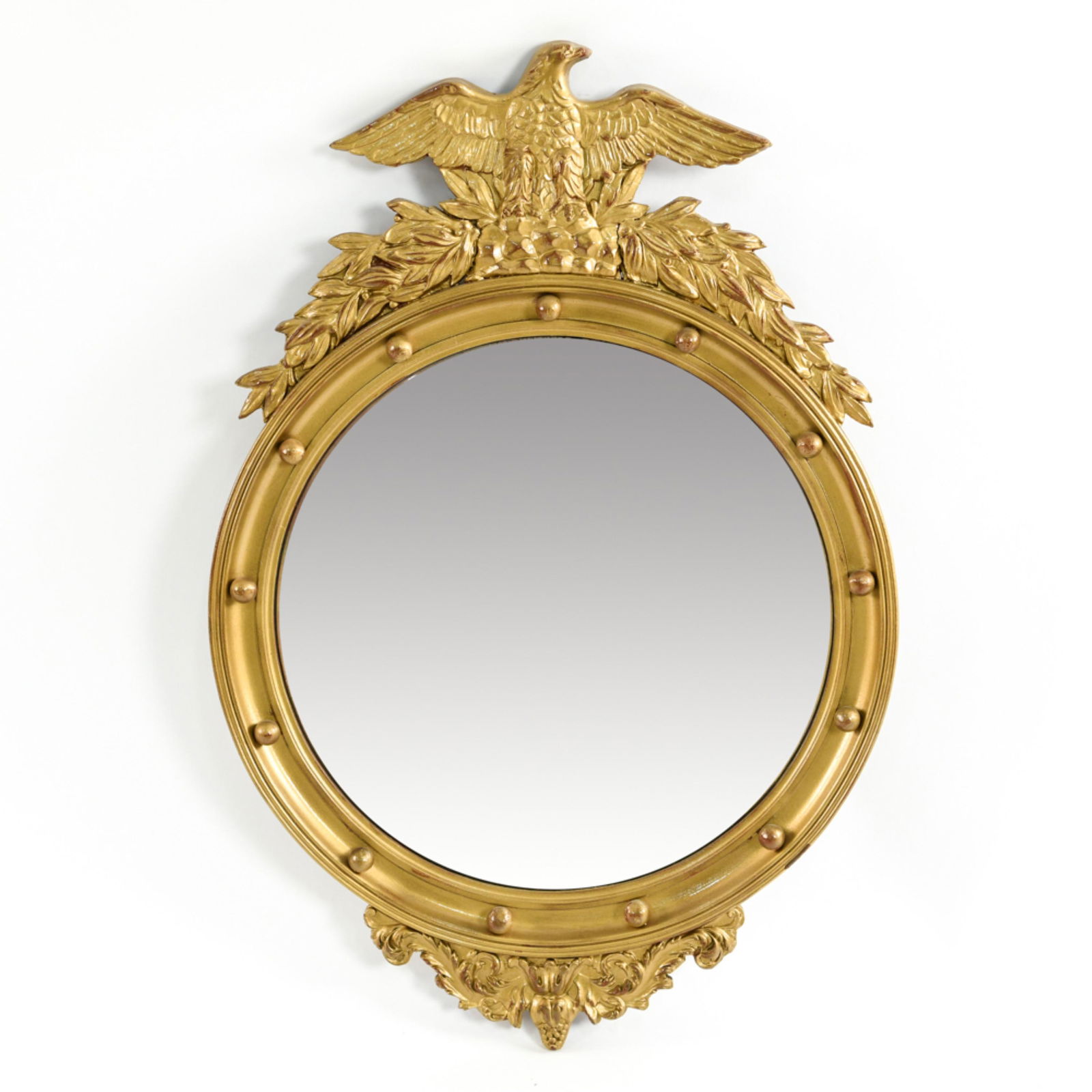 CONVEX MIRROR WITH EAGLE: Dimensions: H 31" x W 21" Condition: Some de-silvering to mirror. Bronze paint surface.